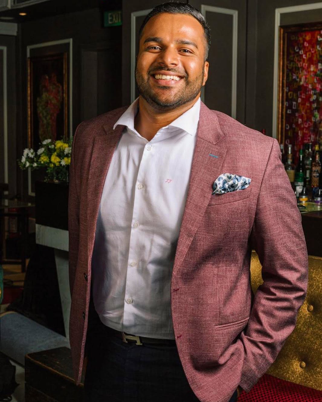 Formal executive portrait in a tailored jacket