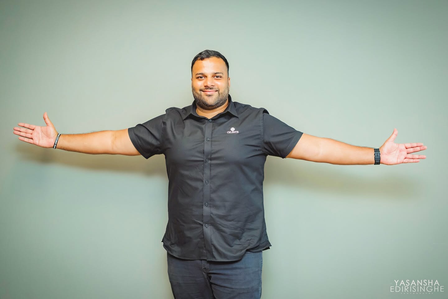 Casual business portrait against a neutral background