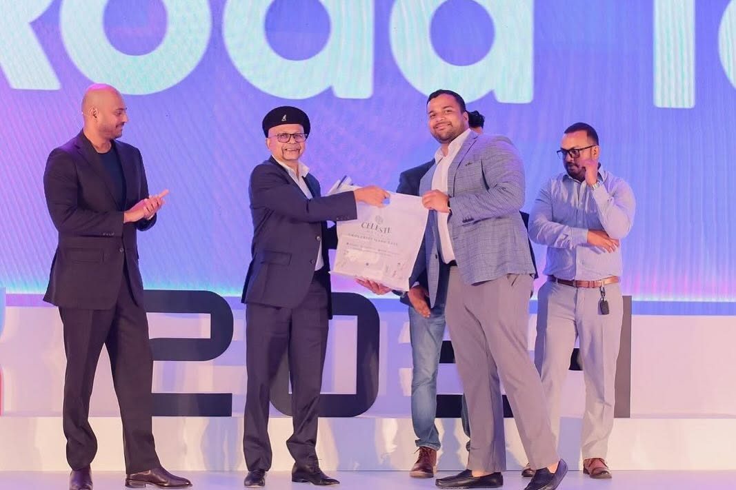 Award being presented on a large event stage