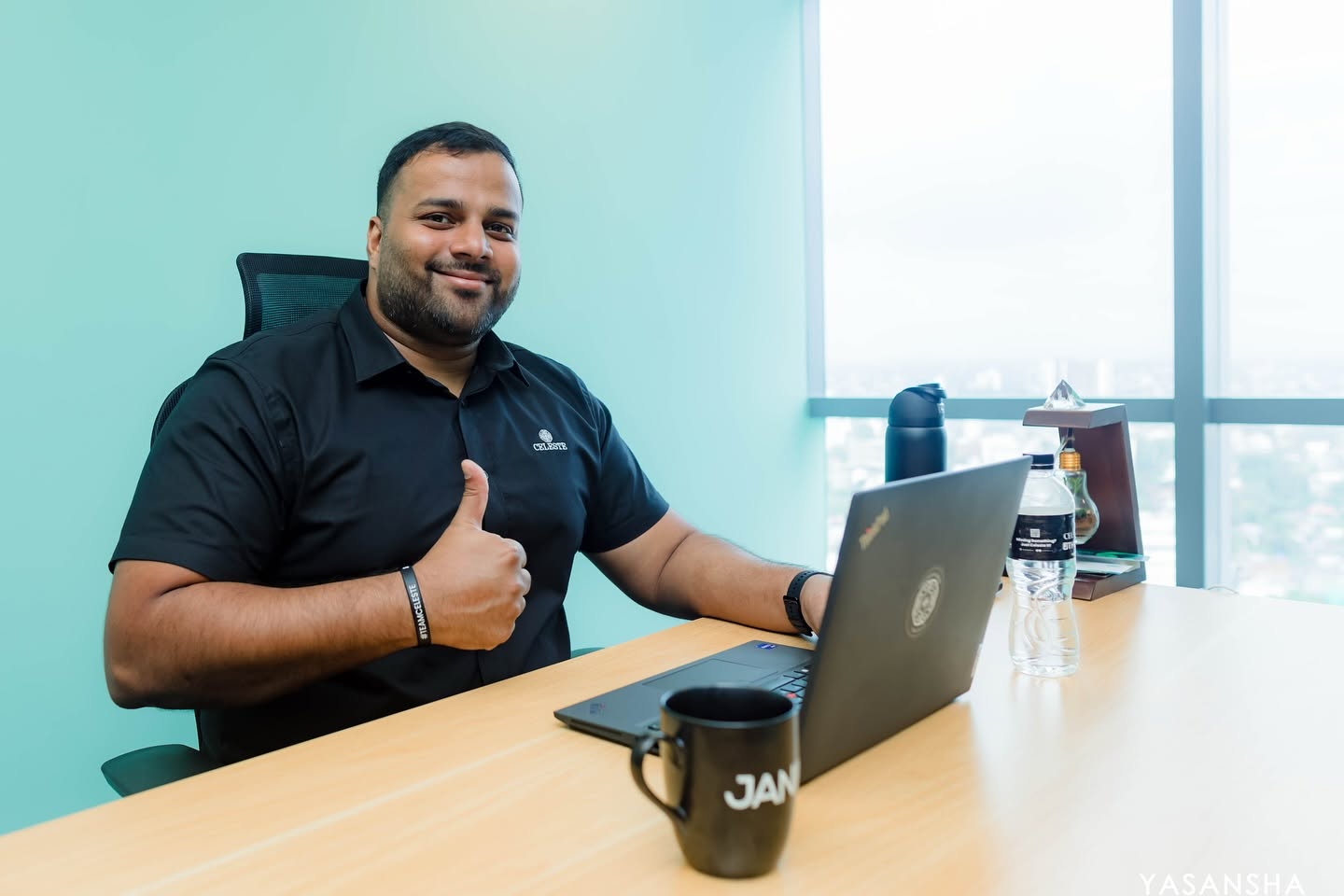 Business leader seated at a desk with a laptop