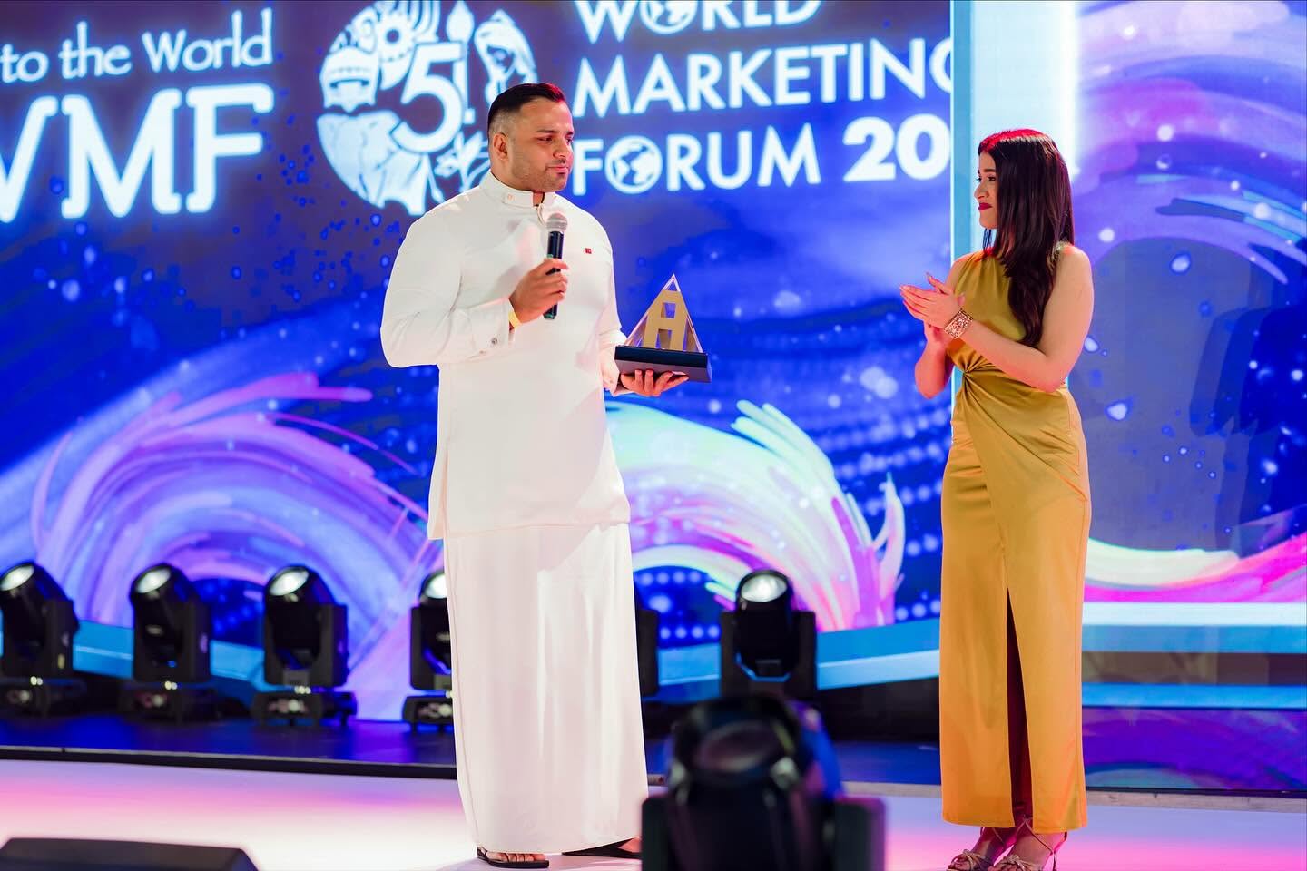 Speaker being interviewed on stage at the World Marketing Forum
